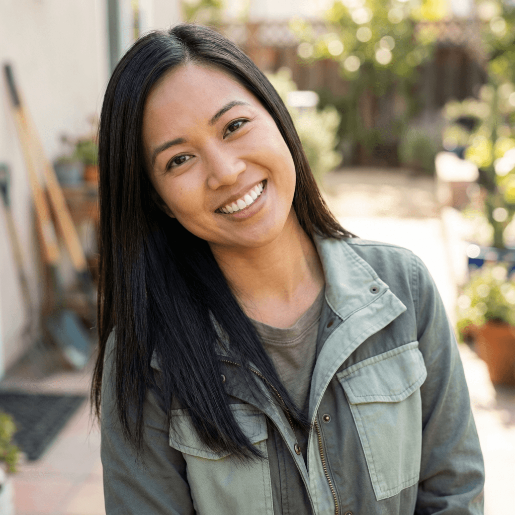 Client care coordinator smiling at the front desk of the auto shop